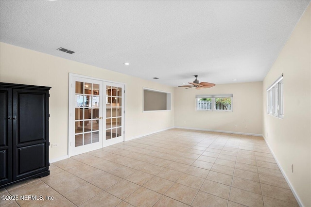 4201 San Pablo Rd S, Jacksonville, FL 32224 - spare room with a ceiling fan, visible vents, french doors, and light tile patterned floors