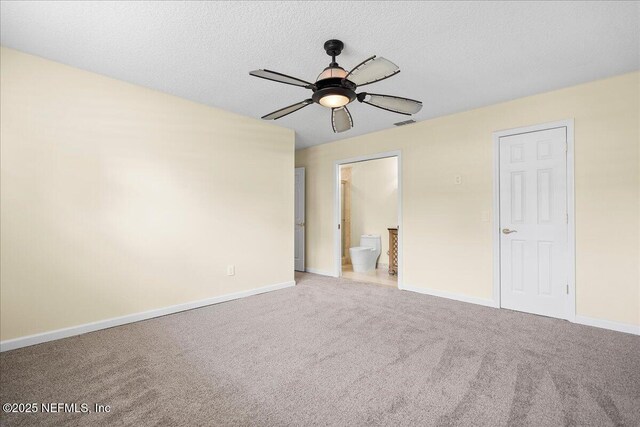 4201 San Pablo Rd S, Jacksonville, FL 32224 - unfurnished bedroom with carpet floors, a textured ceiling, baseboards, and connected bathroom