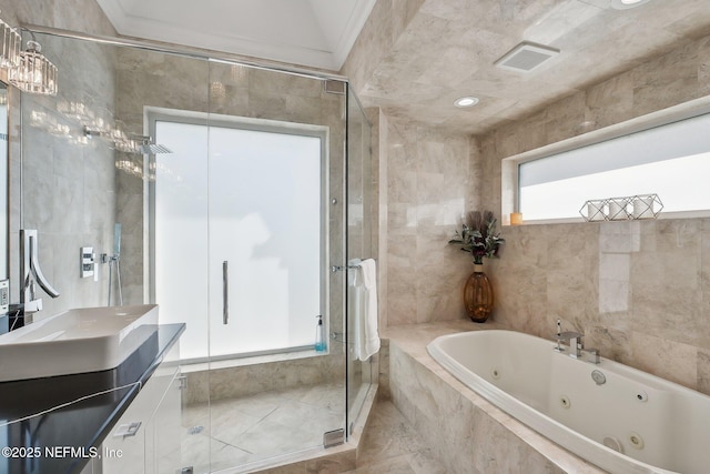 116 Lost Beach Ln, Ponte Vedra Beach, FL 32082 - full bathroom with vanity, visible vents, tile walls, a tub with jets, and a shower stall