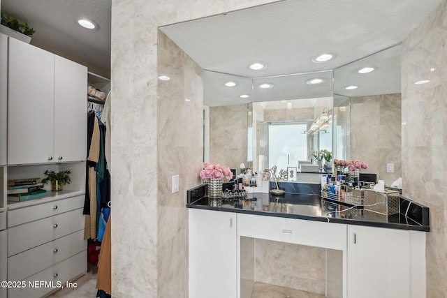 116 Lost Beach Ln, Ponte Vedra Beach, FL 32082 - full bath with recessed lighting, tile walls, a walk in closet, and vanity