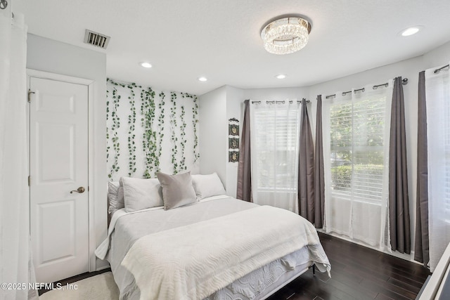 116 Lost Beach Ln, Ponte Vedra Beach, FL 32082 - bedroom with recessed lighting, a notable chandelier, visible vents, and dark wood-type flooring