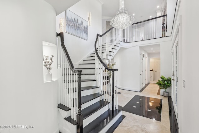 116 Lost Beach Ln, Ponte Vedra Beach, FL 32082 - stairway with recessed lighting, a high ceiling, an inviting chandelier, and baseboards
