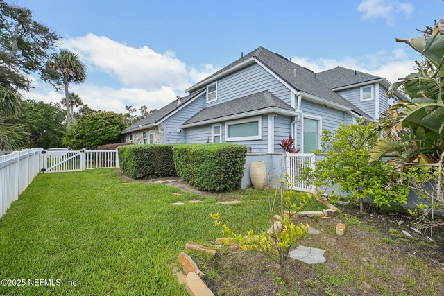 116 Lost Beach Ln, Ponte Vedra Beach, FL 32082 - view of home's exterior with a yard, a shingled roof, a gate, and a fenced backyard