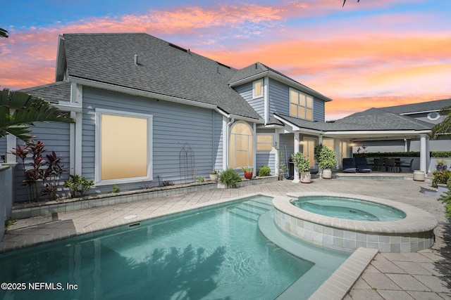 116 Lost Beach Ln, Ponte Vedra Beach, FL 32082 - rear view of property with roof with shingles, a pool with connected hot tub, and a patio area