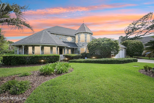 116 Lost Beach Ln, Ponte Vedra Beach, FL 32082 - french country inspired facade with a garage, concrete driveway, a front lawn, and stone siding