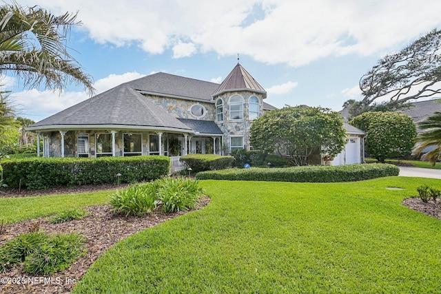 116 Lost Beach Ln, Ponte Vedra Beach, FL 32082 - exterior space with a porch, driveway, a front yard, a garage, and stone siding