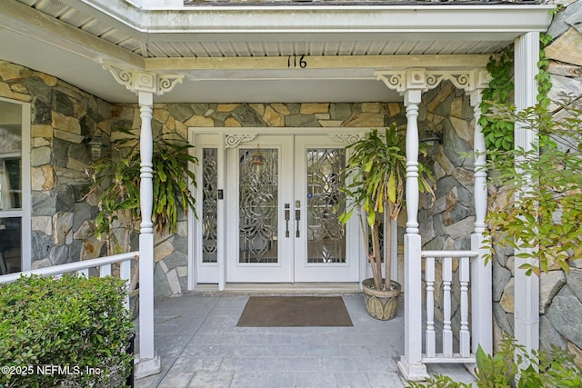 116 Lost Beach Ln, Ponte Vedra Beach, FL 32082 - doorway to property with french doors and stone siding