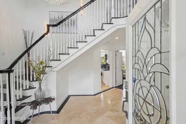 116 Lost Beach Ln, Ponte Vedra Beach, FL 32082 - entryway with baseboards, a high ceiling, stairway, recessed lighting, and tile patterned floors