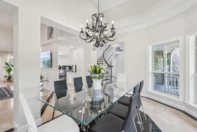 116 Lost Beach Ln, Ponte Vedra Beach, FL 32082 - dining space featuring crown molding, a high ceiling, an inviting chandelier, and stairway