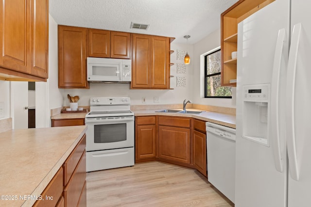 1625 Panther Ridge Ct, Jacksonville, FL 32225 - kitchen with a sink, white appliances, open shelves, visible vents, and light countertops
