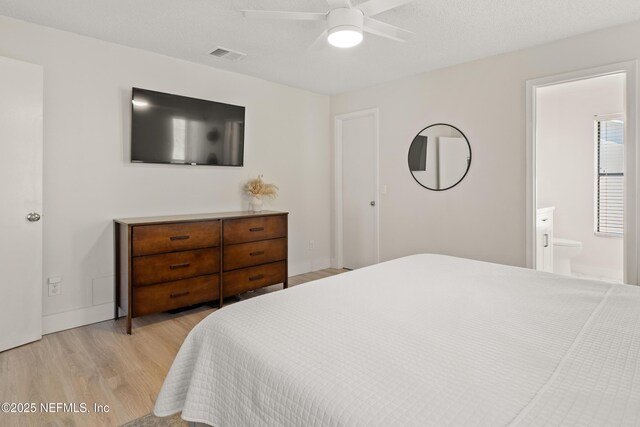 1625 Panther Ridge Ct, Jacksonville, FL 32225 - bedroom with visible vents, baseboards, light wood-style flooring, and ensuite bathroom