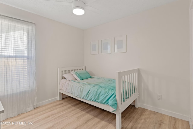 1625 Panther Ridge Ct, Jacksonville, FL 32225 - bedroom with wood finished floors, ceiling fan, and baseboards