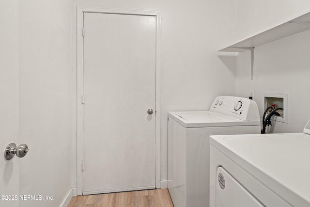 1625 Panther Ridge Ct, Jacksonville, FL 32225 - laundry area with light wood-type flooring, separate washer and dryer, and laundry area