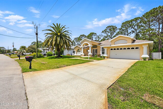 68 Webster Ln, Palm Coast, FL 32164 - view of front of property featuring a front yard, concrete driveway, a garage, and stucco siding