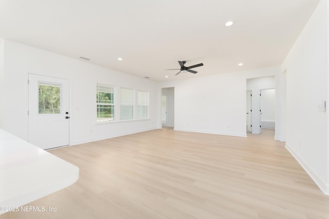295 SE 57th St, Keystone Heights, FL 32656 - unfurnished living room featuring light wood-style flooring, recessed lighting, ceiling fan, and baseboards