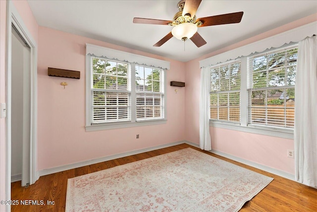 4379 San Jose Blvd, Jacksonville, FL 32207 - empty room with ceiling fan, wood finished floors, and baseboards