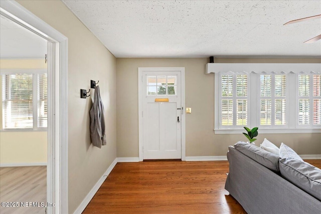 4379 San Jose Blvd, Jacksonville, FL 32207 - foyer featuring wood finished floors, baseboards, and a textured ceiling