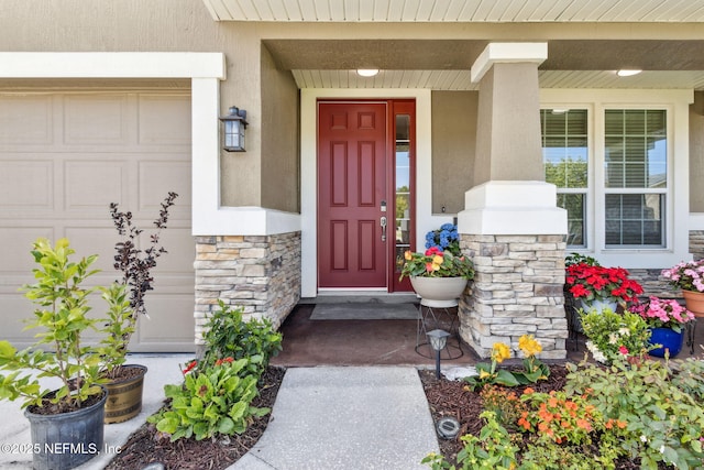 124 Sarah Elizabeth Dr, Saint Johns, FL 32259 - entrance to property with stone siding, stucco siding, covered porch, and an attached garage