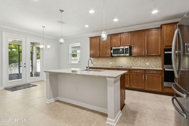 124 Sarah Elizabeth Dr, Saint Johns, FL 32259 - kitchen with a sink, stainless steel appliances, crown molding, backsplash, and light tile patterned floors