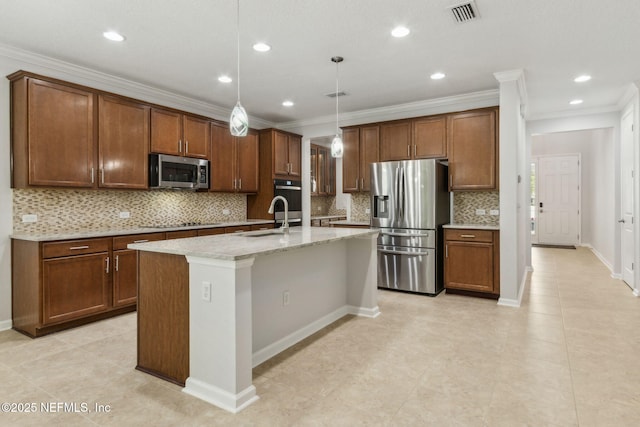124 Sarah Elizabeth Dr, Saint Johns, FL 32259 - kitchen featuring visible vents, a sink, backsplash, a kitchen island with sink, and appliances with stainless steel finishes