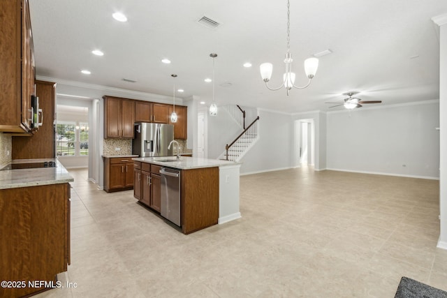 124 Sarah Elizabeth Dr, Saint Johns, FL 32259 - kitchen with a sink, ceiling fan with notable chandelier, crown molding, decorative backsplash, and appliances with stainless steel finishes