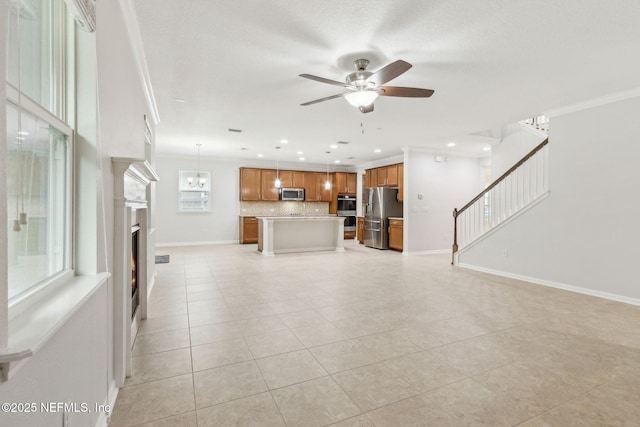 124 Sarah Elizabeth Dr, Saint Johns, FL 32259 - unfurnished living room with light tile patterned floors, stairs, ornamental molding, and ceiling fan