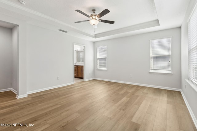 124 Sarah Elizabeth Dr, Saint Johns, FL 32259 - empty room featuring baseboards, visible vents, ceiling fan, a raised ceiling, and light wood-style floors
