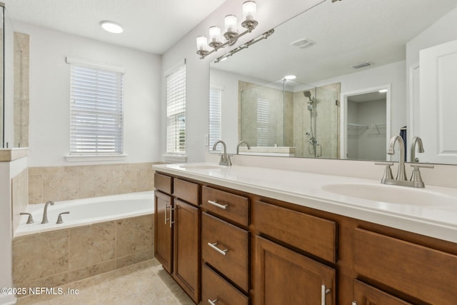 124 Sarah Elizabeth Dr, Saint Johns, FL 32259 - bathroom featuring double vanity, a garden tub, a stall shower, and a sink