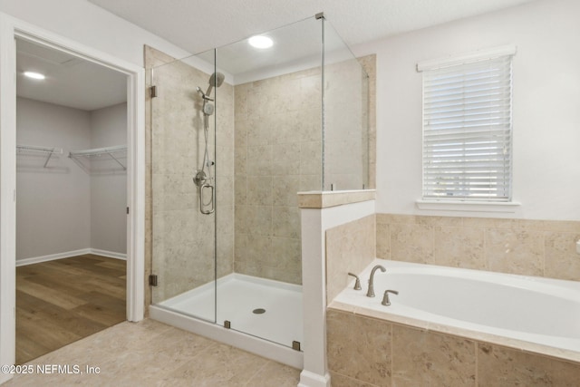 124 Sarah Elizabeth Dr, Saint Johns, FL 32259 - full bath with a shower stall, a spacious closet, a garden tub, and recessed lighting
