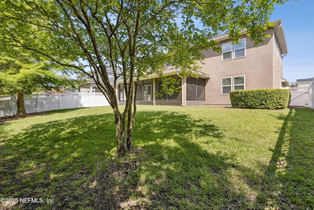 124 Sarah Elizabeth Dr, Saint Johns, FL 32259 - back of house with a lawn, stucco siding, a sunroom, fence private yard, and a gate
