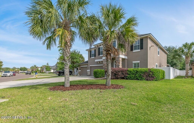 view of front of home with a garage, concrete driveway, and stucco siding