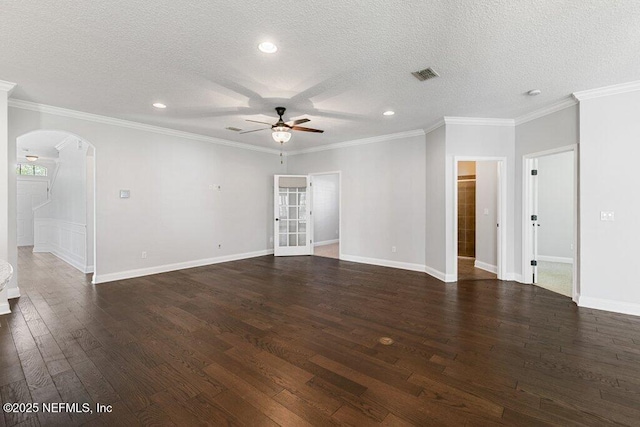 unfurnished living room with arched walkways, ceiling fan, dark wood-style floors, a textured ceiling, and recessed lighting