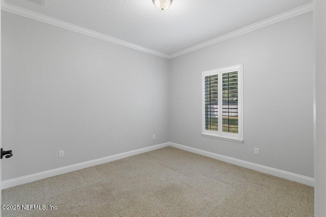 unfurnished room featuring ornamental molding, carpet floors, baseboards, and a textured ceiling