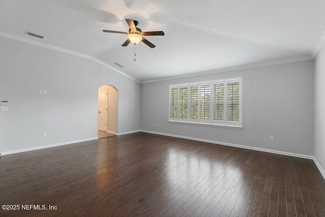 empty room with a ceiling fan, dark wood-style floors, arched walkways, baseboards, and vaulted ceiling