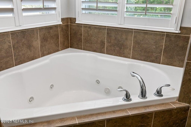 full bath with a whirlpool tub