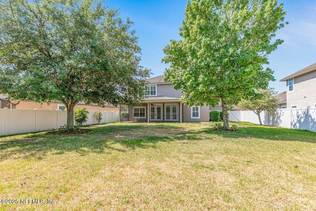 view of yard featuring french doors