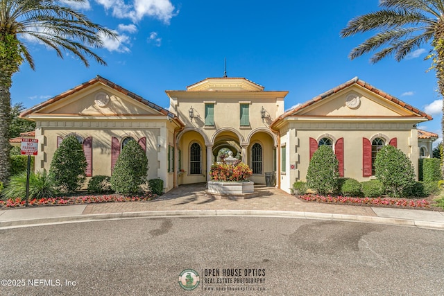 mediterranean / spanish-style house with stucco siding