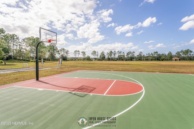 view of sport court with community basketball court and a lawn