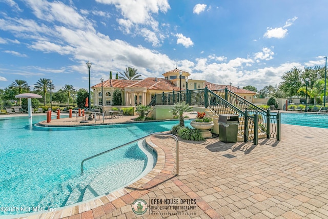 community pool with a patio