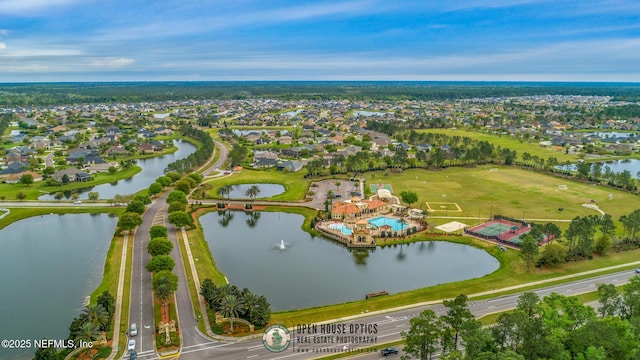 aerial view of residential area featuring a nearby body of water