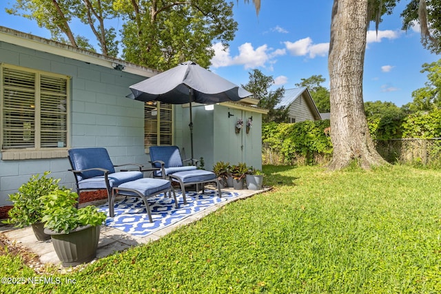 view of yard with fence and a patio area
