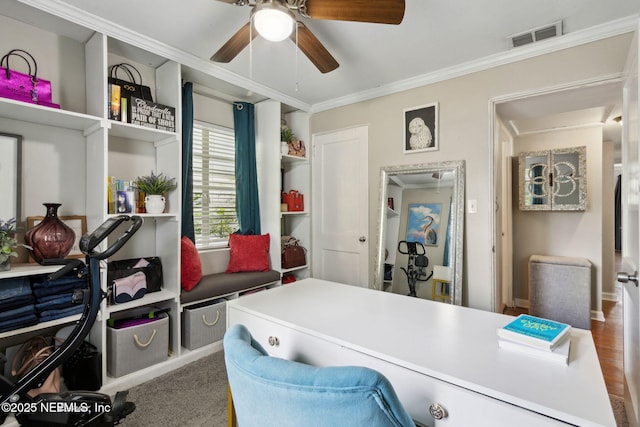 office space featuring visible vents, ceiling fan, and crown molding
