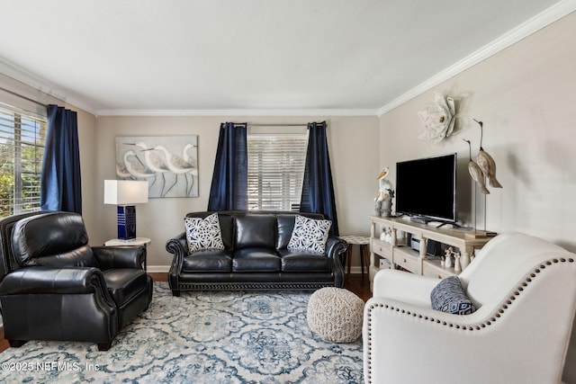 living room featuring wood finished floors, crown molding, and baseboards