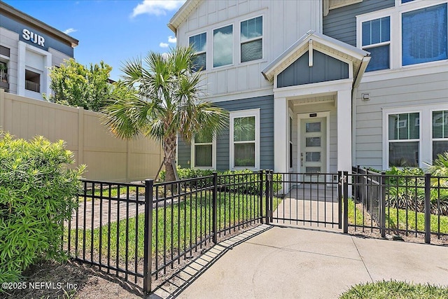 view of patio featuring fence and a gate