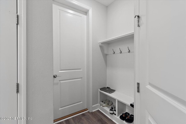 mudroom with dark wood-style flooring