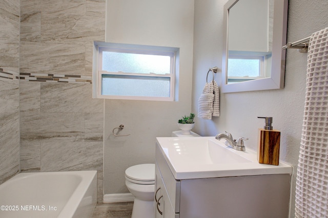 full bath featuring toilet and vanity