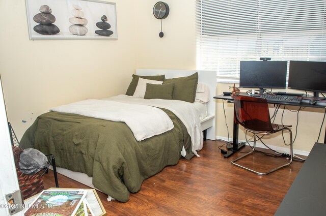 bedroom with wood finished floors