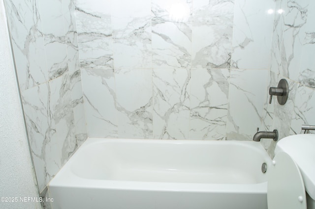 full bathroom with a tub