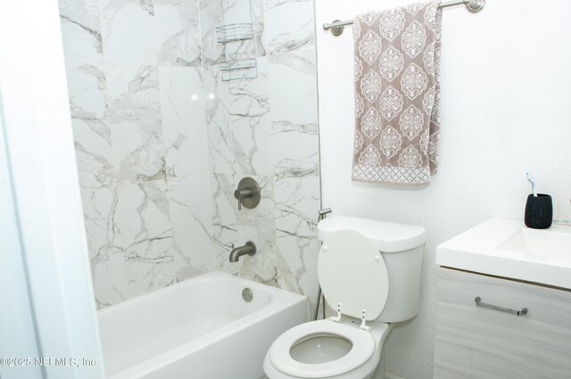 bathroom featuring vanity, toilet, and shower / bath combination
