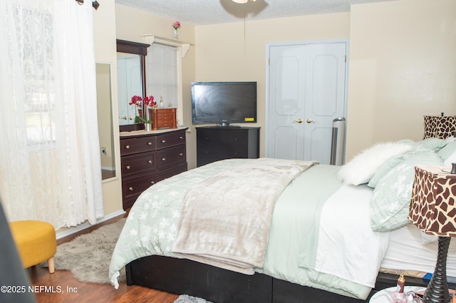 bedroom featuring a closet and wood finished floors
